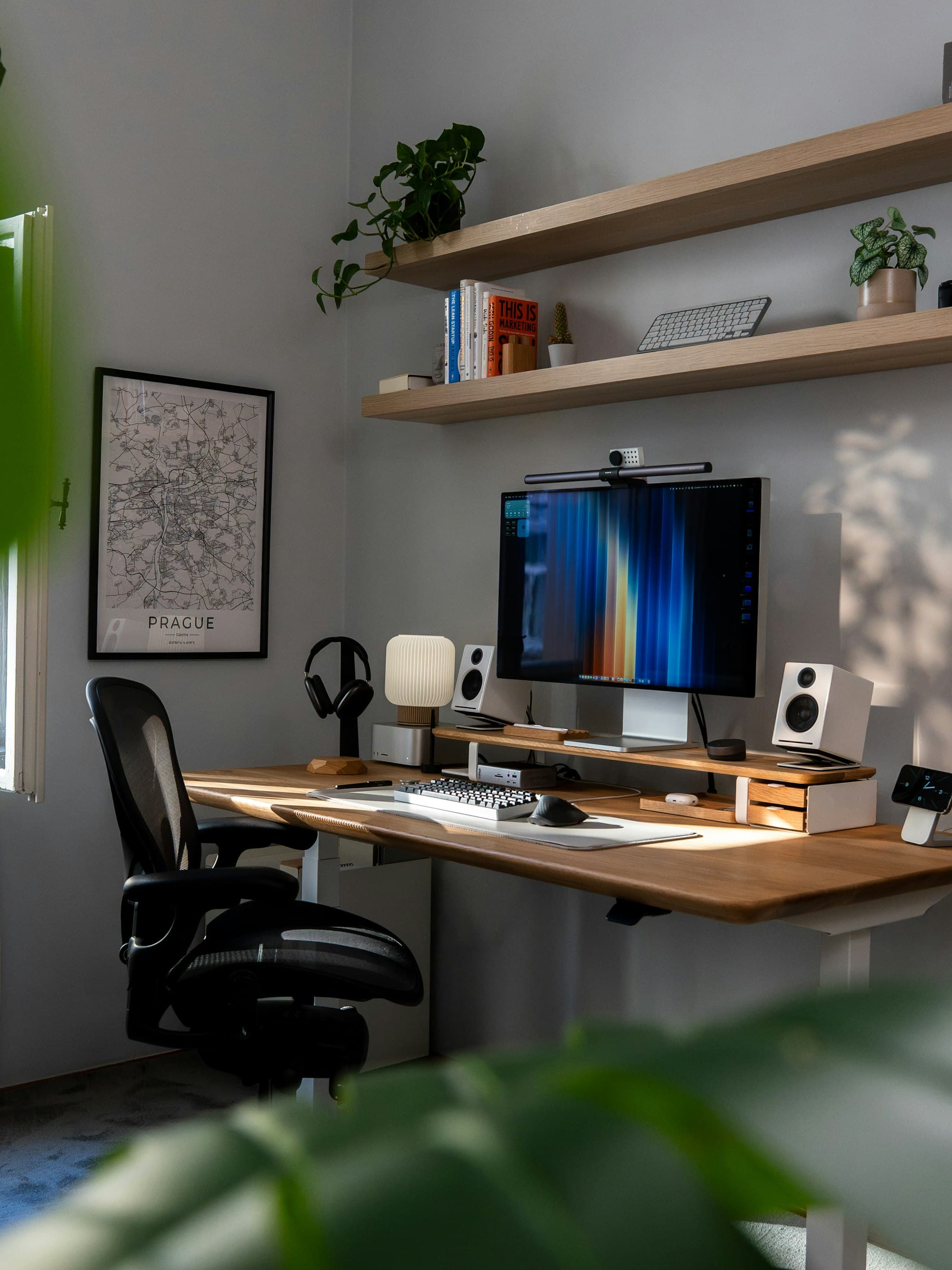 Quiet creative studio desk with espresso and kraft notebook
